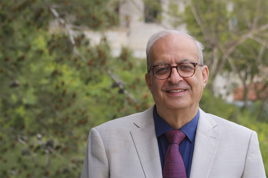 Smiling older man in suit and tie outdoors