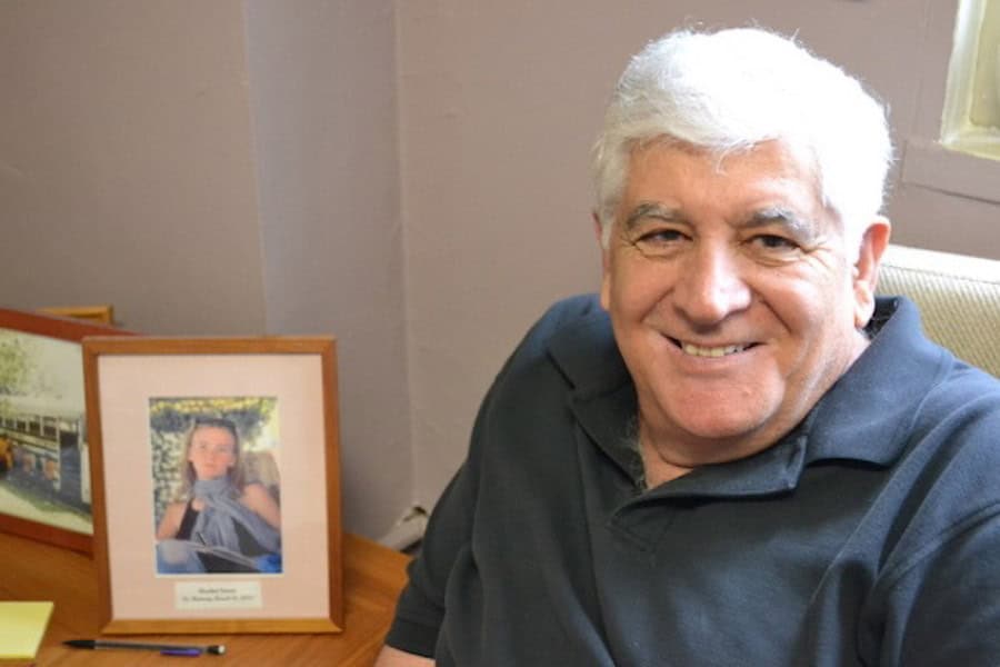 Dr Mubarak Awad with framed photo of Rachel Corrie, an American nonviolent protester crushed to death by an Israeli military bulldozer in 2003.
