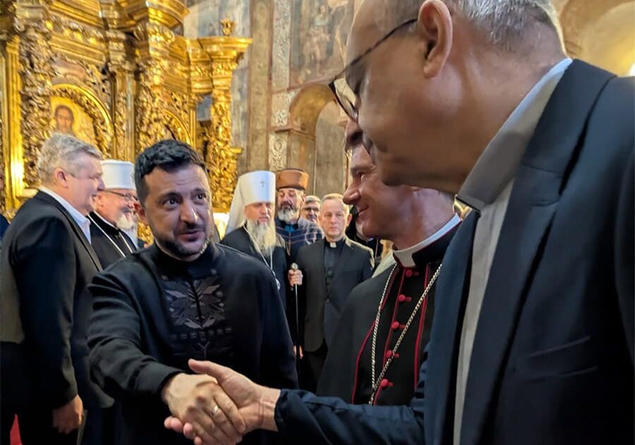 1.	WEA Secretary General shaking hands with President of Ukraine 